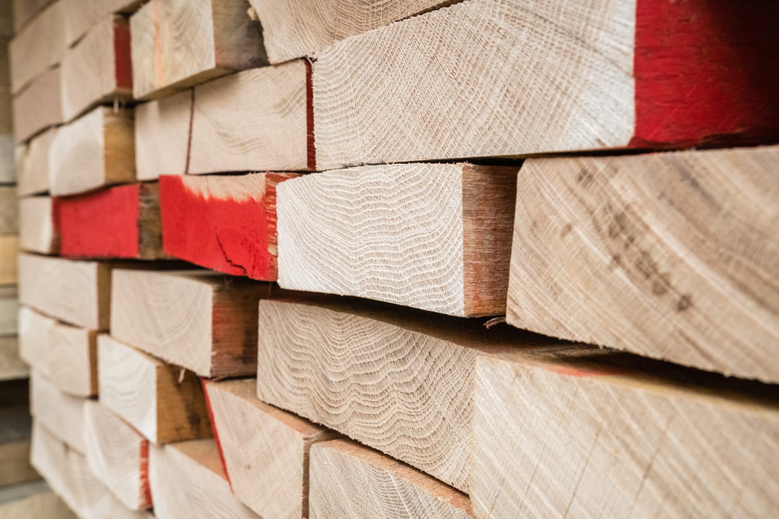 Stacks of lumber being stored in a warehouse